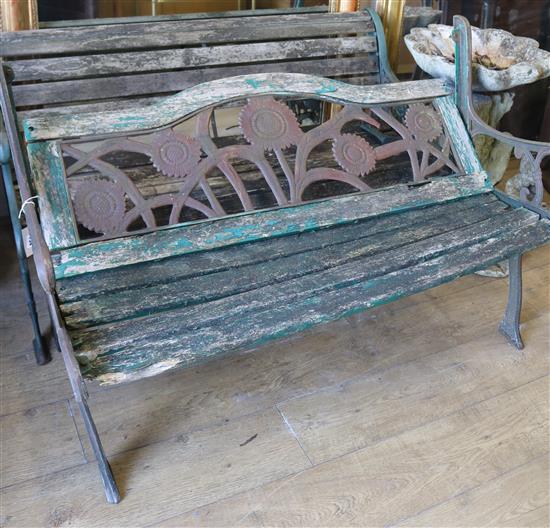 A garden bench with a sunflower panel back and another W.127cm